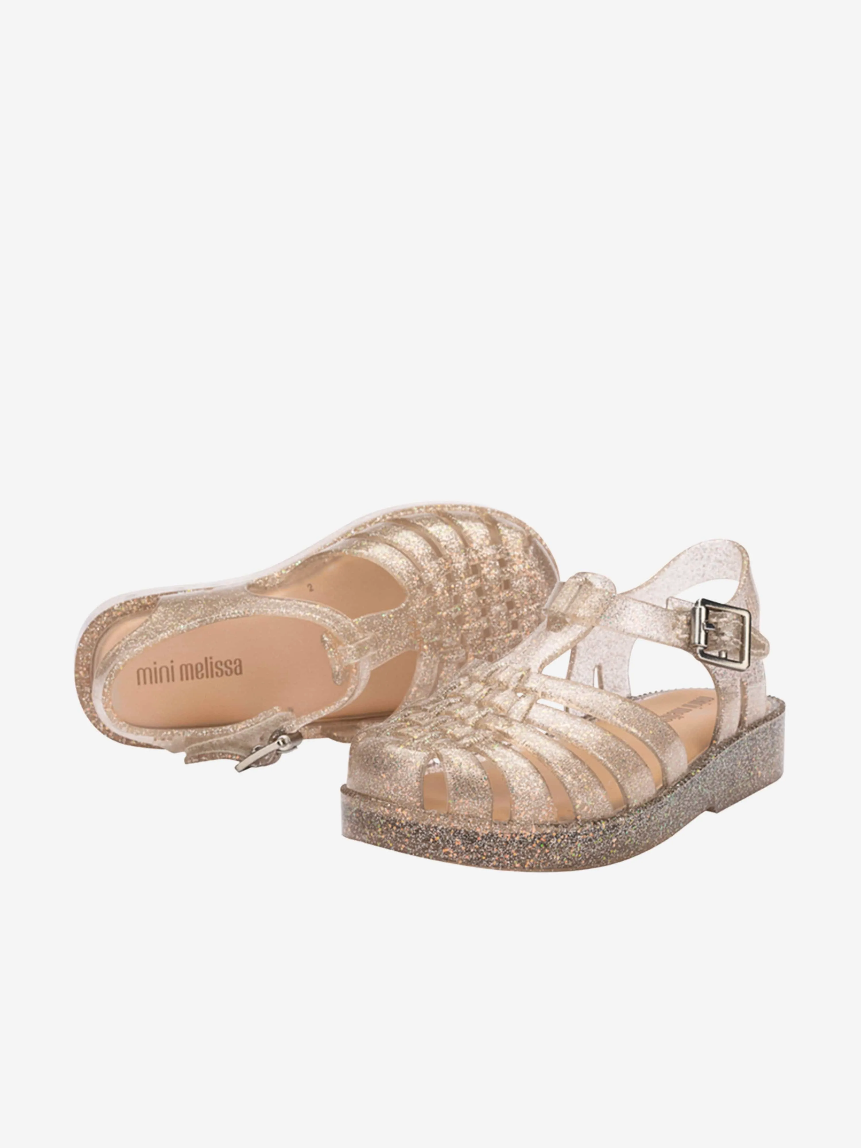 Mädchen Besitz Glänzende Sandalen in Gold